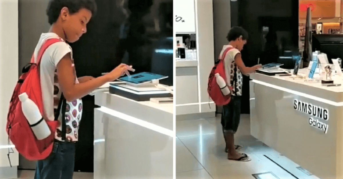 Menino filmado estudando em um tablet de uma loja, ganha o aparelho da Samsung Guilherme pesquisando no tablet - Menino filmado estudando em um tablet de uma loja, ganha o aparelho da Samsung