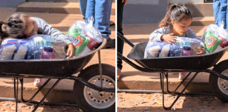 A felicidade da menina ao receber uma cesta básica, ela abraça e olha detalhadamente tudo que tem dentro