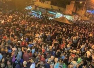 “Pagode da Covid” é promovido por milhares de pessoas sem máscaras na periferia de São Vicente, SP.
